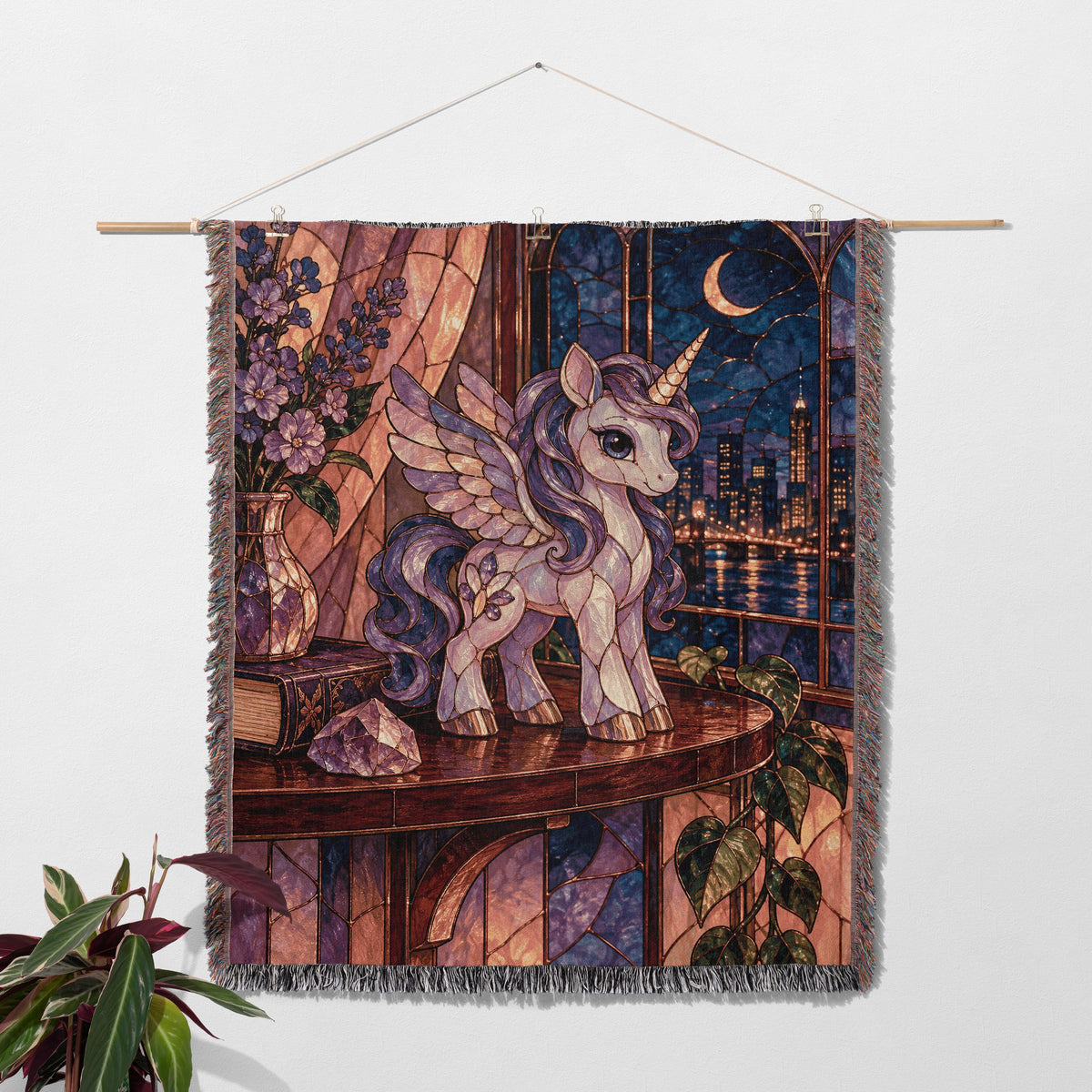 Pegasus Woven Throw Blanket hanging on a wall with a plant