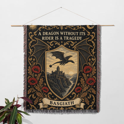 Basgiath Dragon Rider Crest Woven Throw Blanket hanging on a wall with a plant