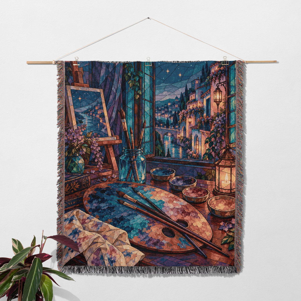 The Rainbow of Velaris Woven Throw Blanket hanging on a wall with a plant