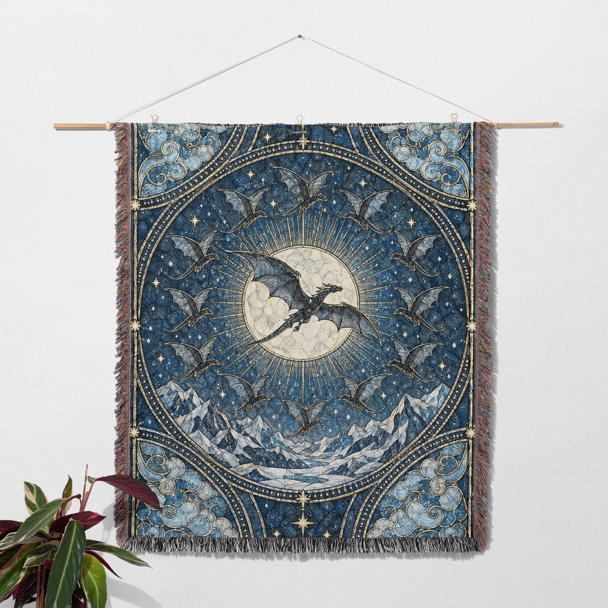 The Thirteen Stained Glass Woven Throw Blanket hanging on a wall with a plant