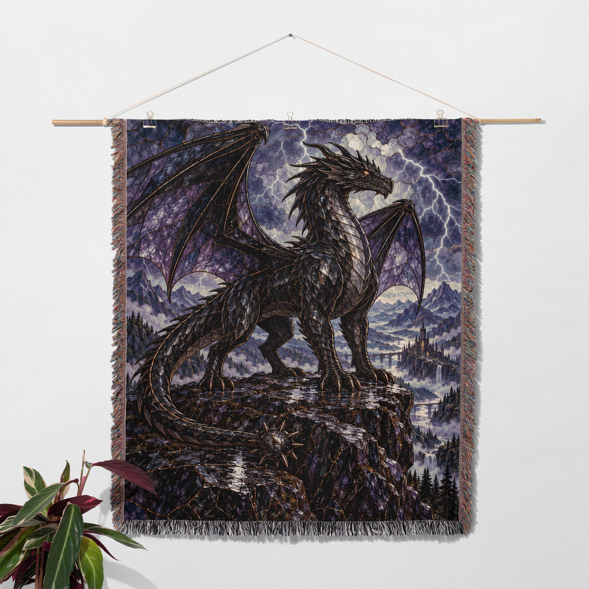 Storm Tairn Woven Throw Blanket hanging on a wall with a plant