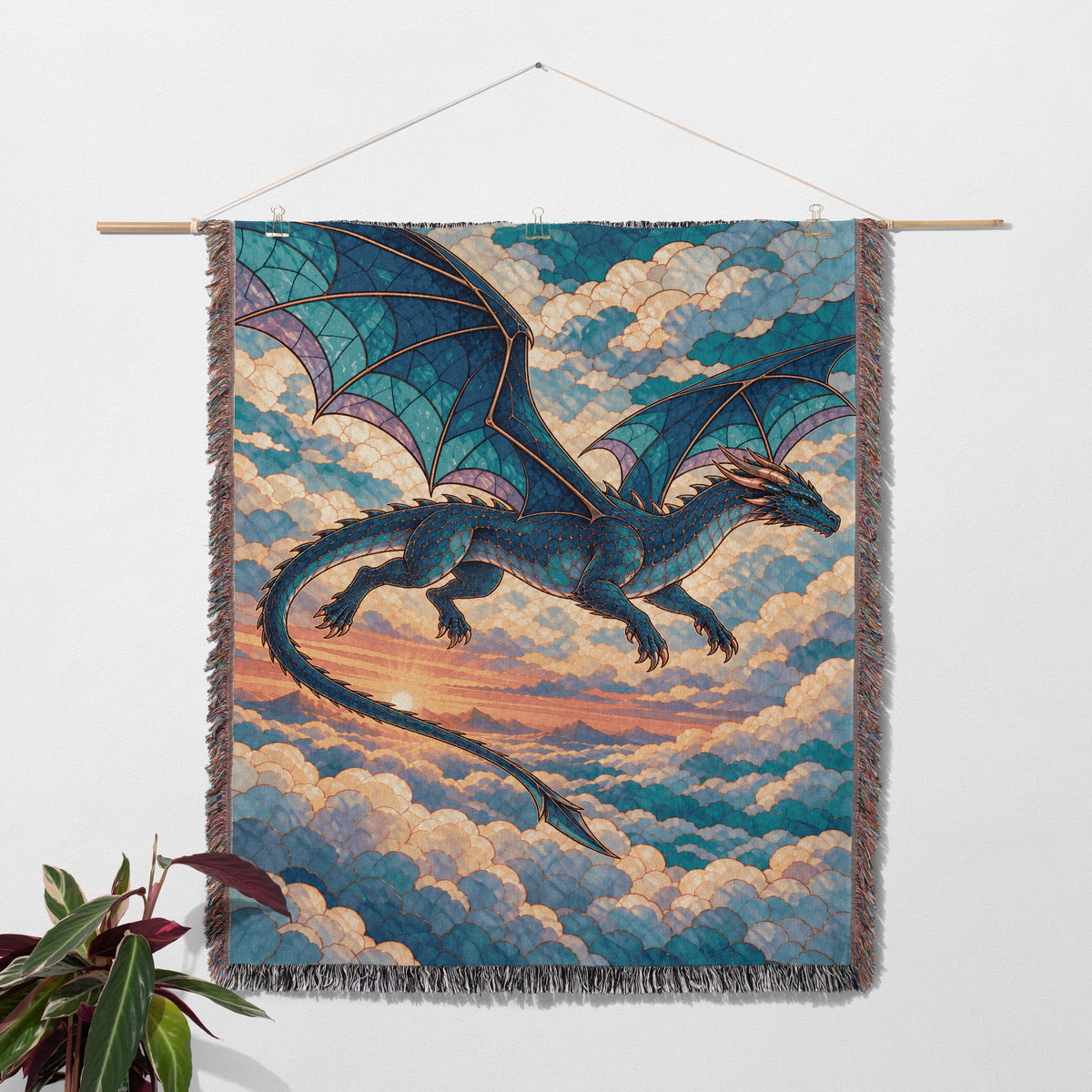 Sgaeyl Dragon Woven Throw Blanket hanging on a wall with a plant