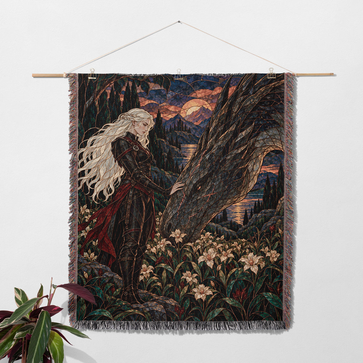 Wildflower Truce Woven Throw Blanket hanging on a wall with a plant