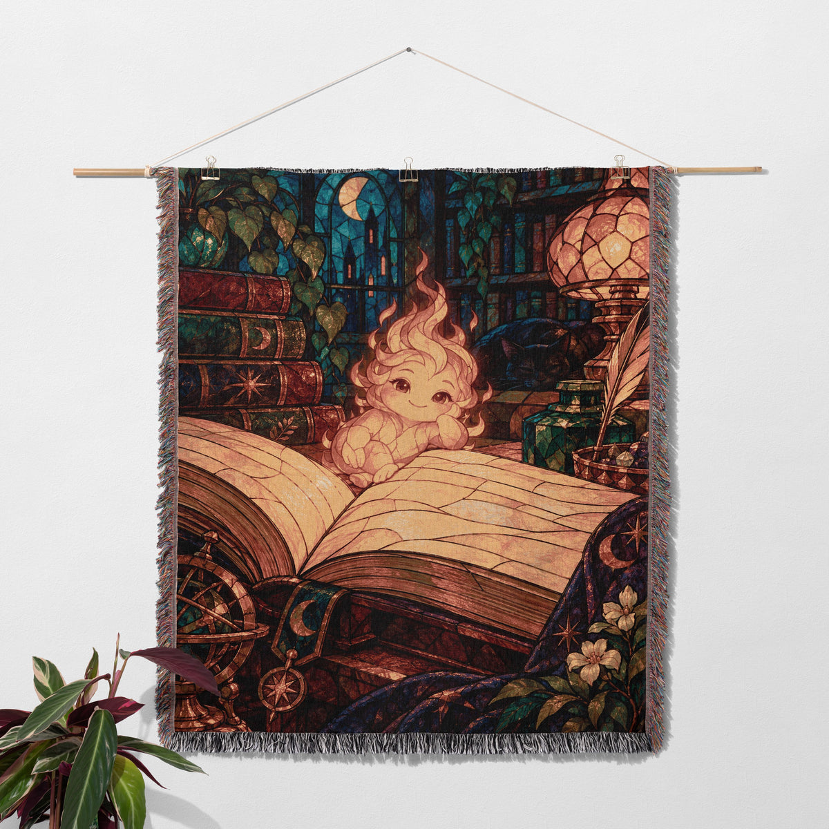 Ember Woven Throw Blanket hanging on a wall with a plant