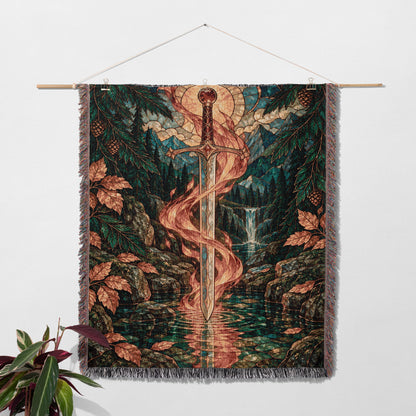 Goldryn Woven Throw Blanket hanging on a wall with a plant