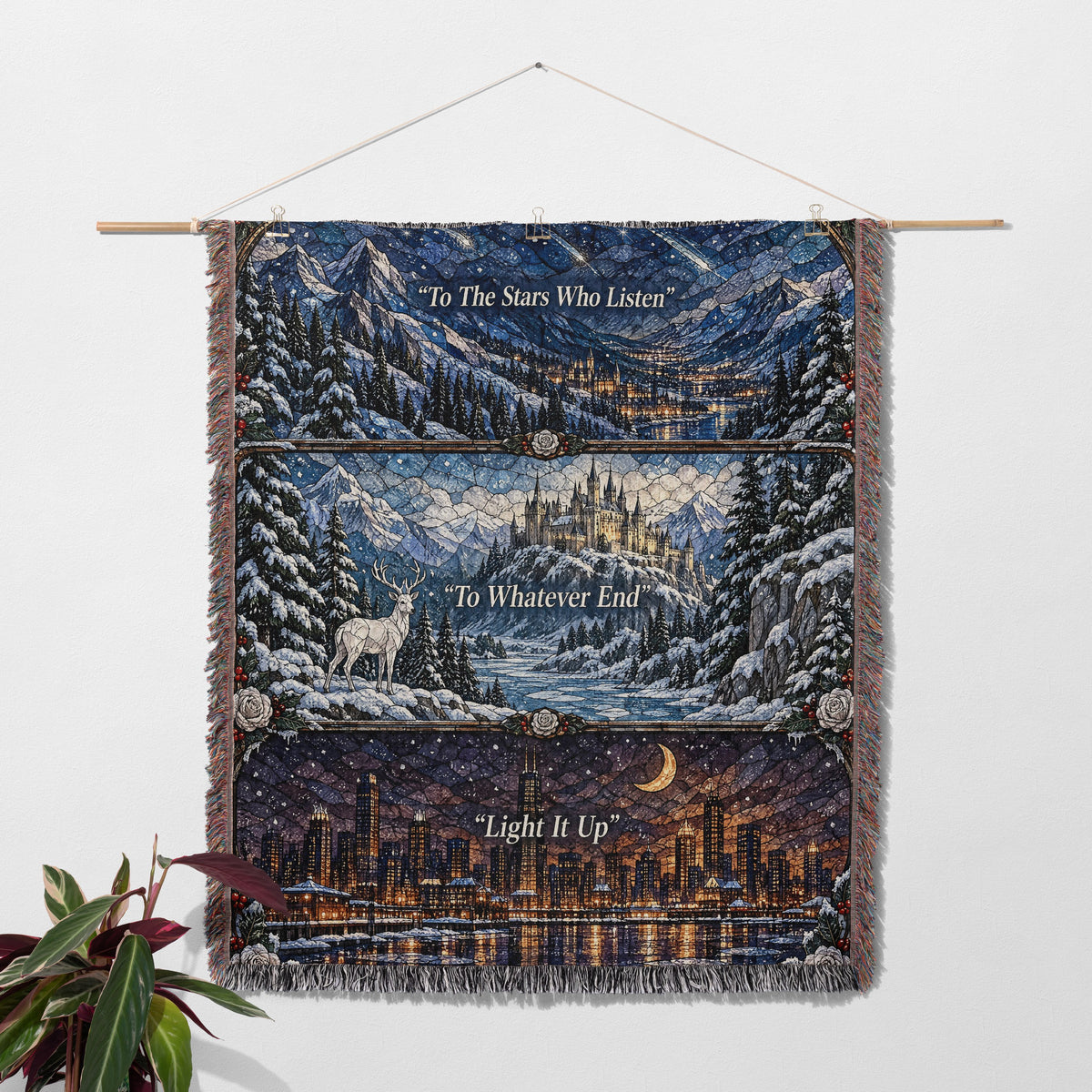 Winter Maasverse Stained Glass Woven Throw Blanket hanging on a wall with a plant