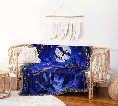 Basgiath by Night Stained Glass Woven Throw Blanket on a rattan chair