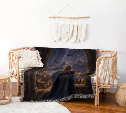 Feyre over Velaris Woven Throw Blanket on a rattan chair