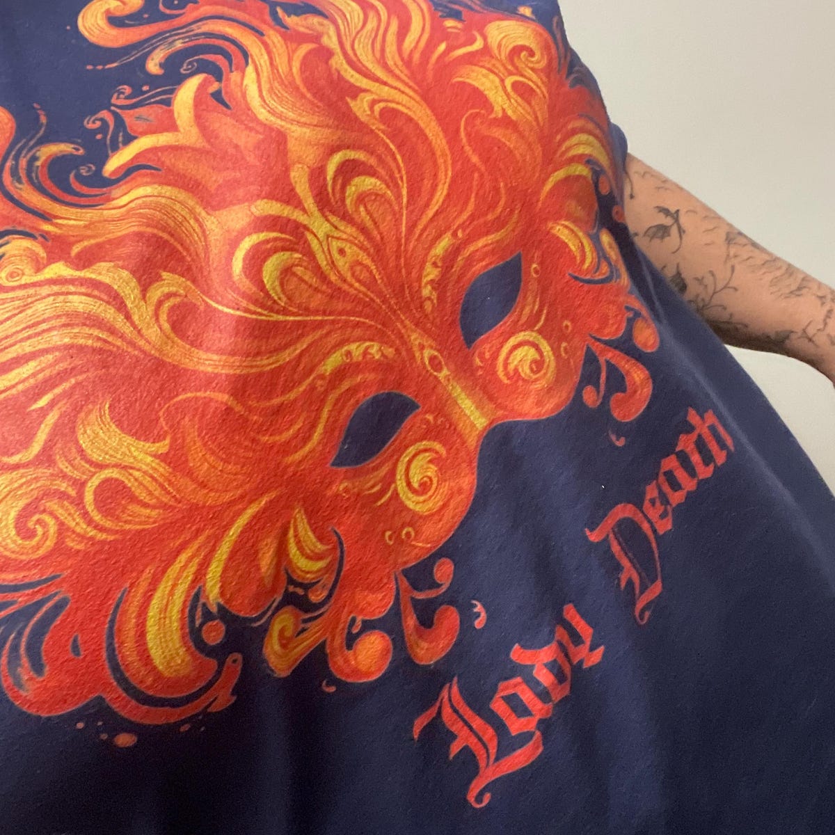 Customer photo: the Lady Death tee worn, close up on the flame mask print.